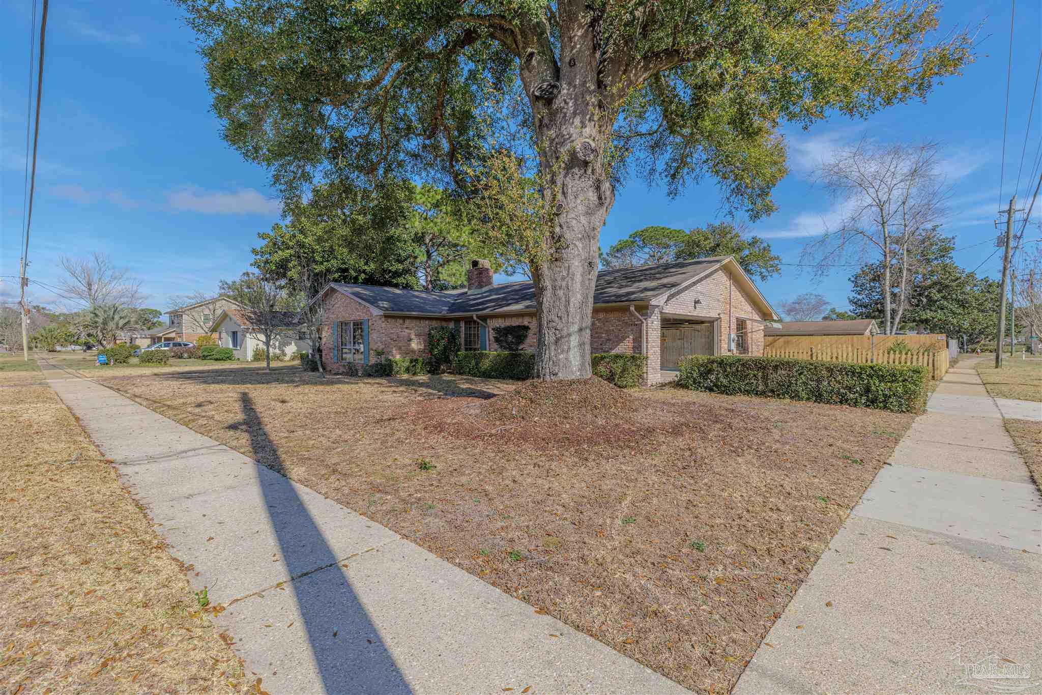 5700 Adelyn Road Pensacola, FL 32504 - Photo 27 of 33 a view of house with a yard and potted plants