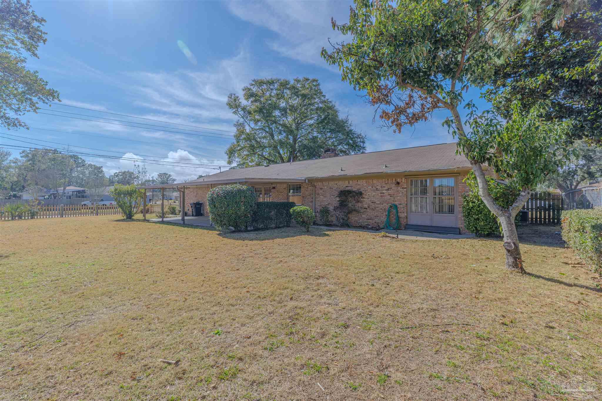 5700 Adelyn Road Pensacola, FL 32504 - Photo 31 of 33 a front view of a house with a yard and garage