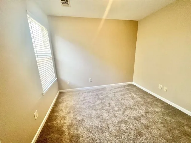 a bathroom with a shower and a sink
