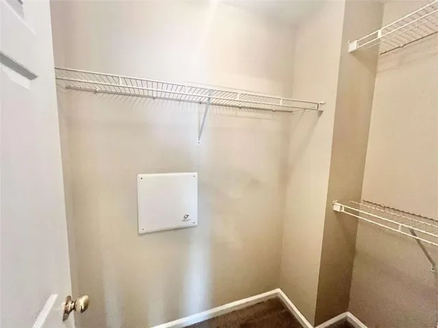 a en suite bathroom with a double vanity sink a large mirror and shower