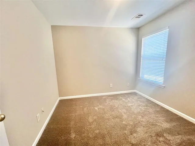 a view of an empty room and window