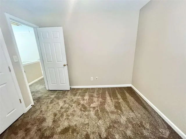 a white toilet sitting next to a bath tub