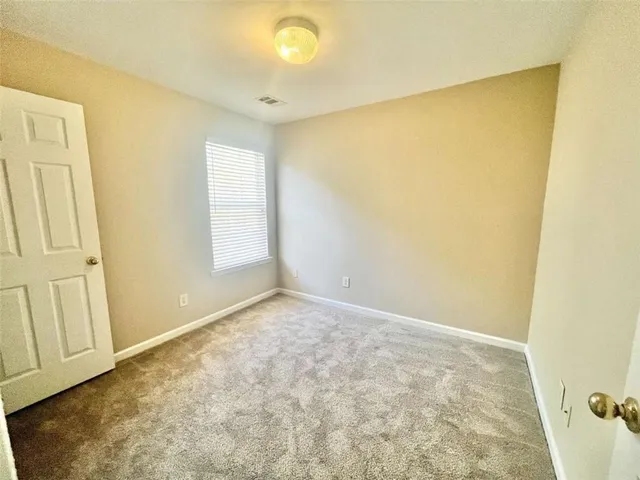 an empty room with a windows