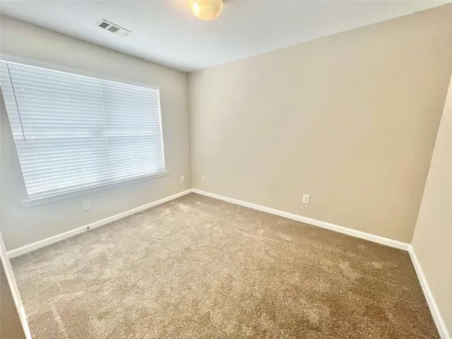 a white toilet sitting in a bathroom next to a sink