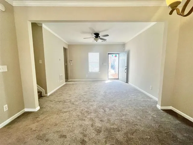 an empty room with a empty space and windows