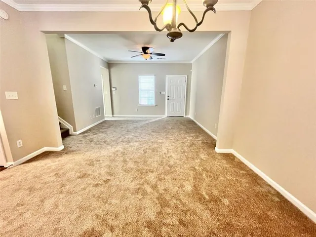 a view of a kitchen with a sink and a chandelier