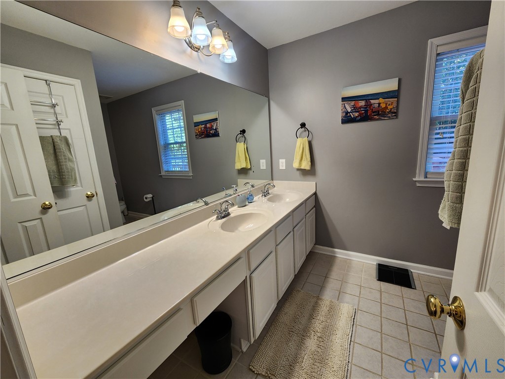 2744 Smokey Road Aylett, VA 23009 - Photo 24 of 72 Double vanity with integrated sinks, expansive mir