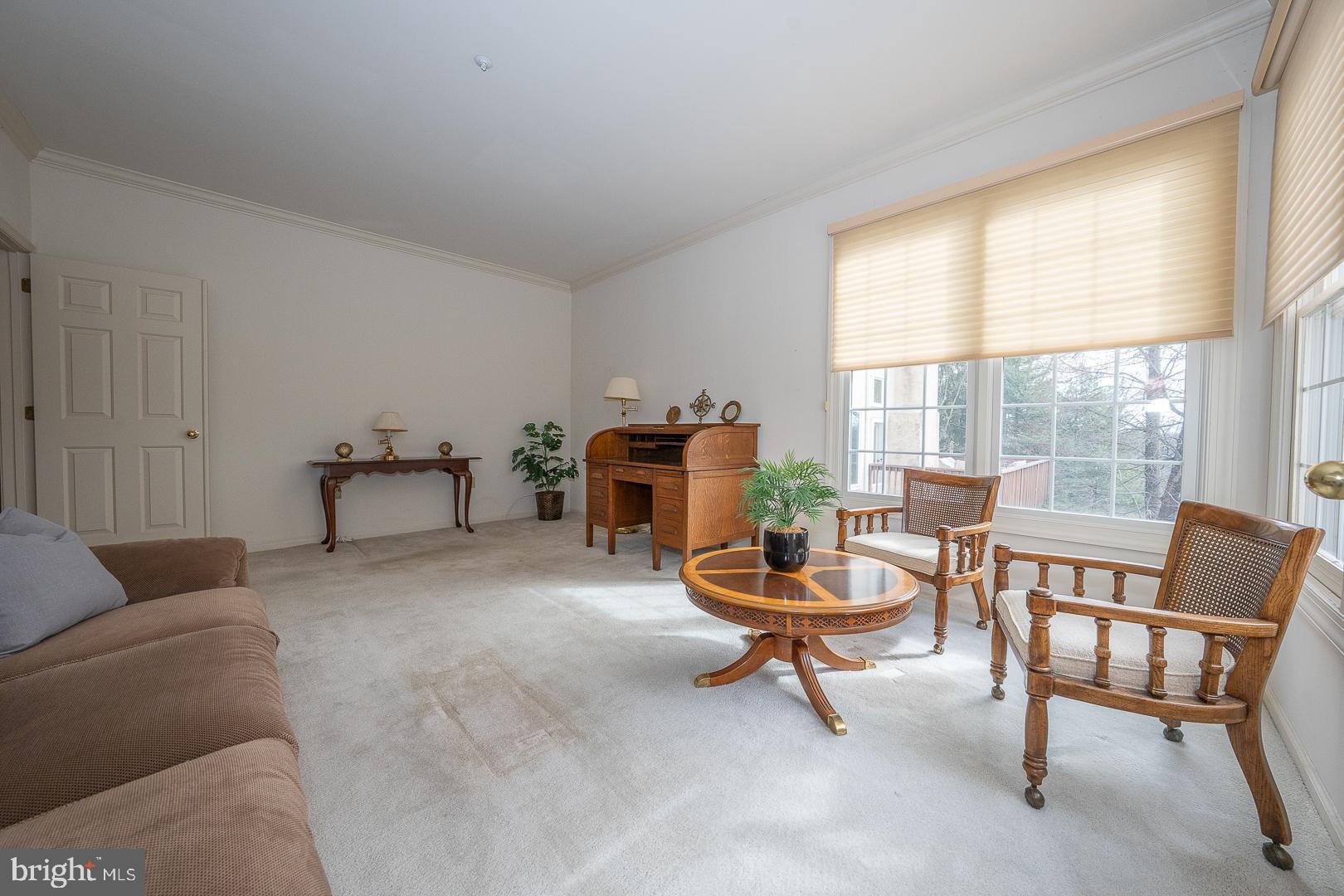 28 Ridgeview Road Newtown Square, PA 19073 - Photo 18 of 49 a living room with furniture and a large window