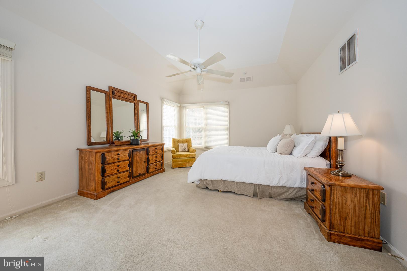 28 Ridgeview Road Newtown Square, PA 19073 - Photo 30 of 49 a spacious bedroom with a bed and a night stand