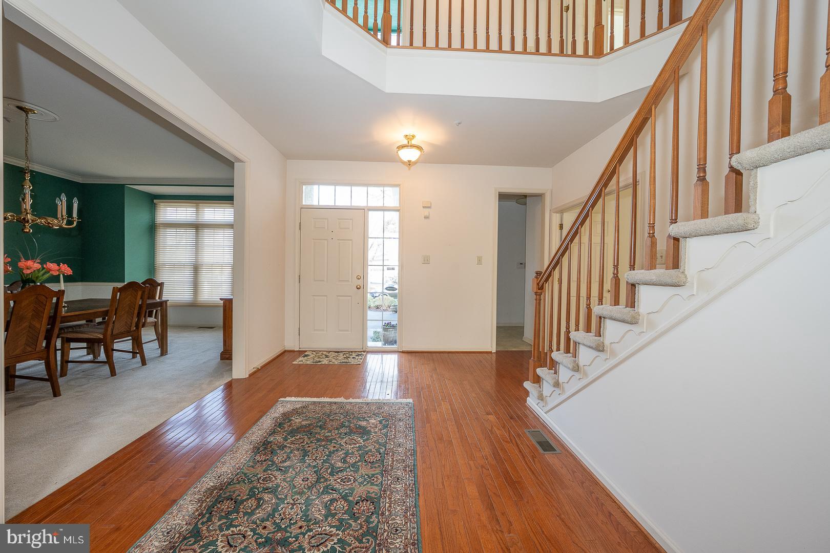 28 Ridgeview Road Newtown Square, PA 19073 - Photo 5 of 49 a view of a livingroom with wooden floor and stairs