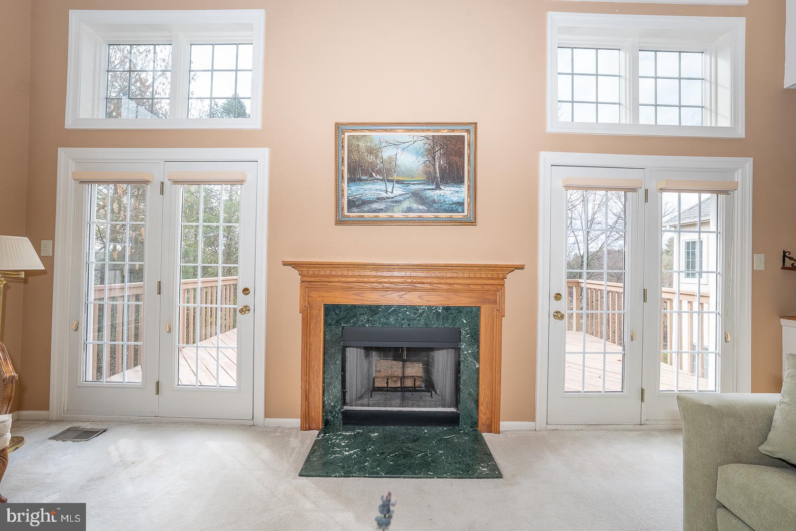 28 Ridgeview Road Newtown Square, PA 19073 - Photo 10 of 49 a living room with a fireplace and windows