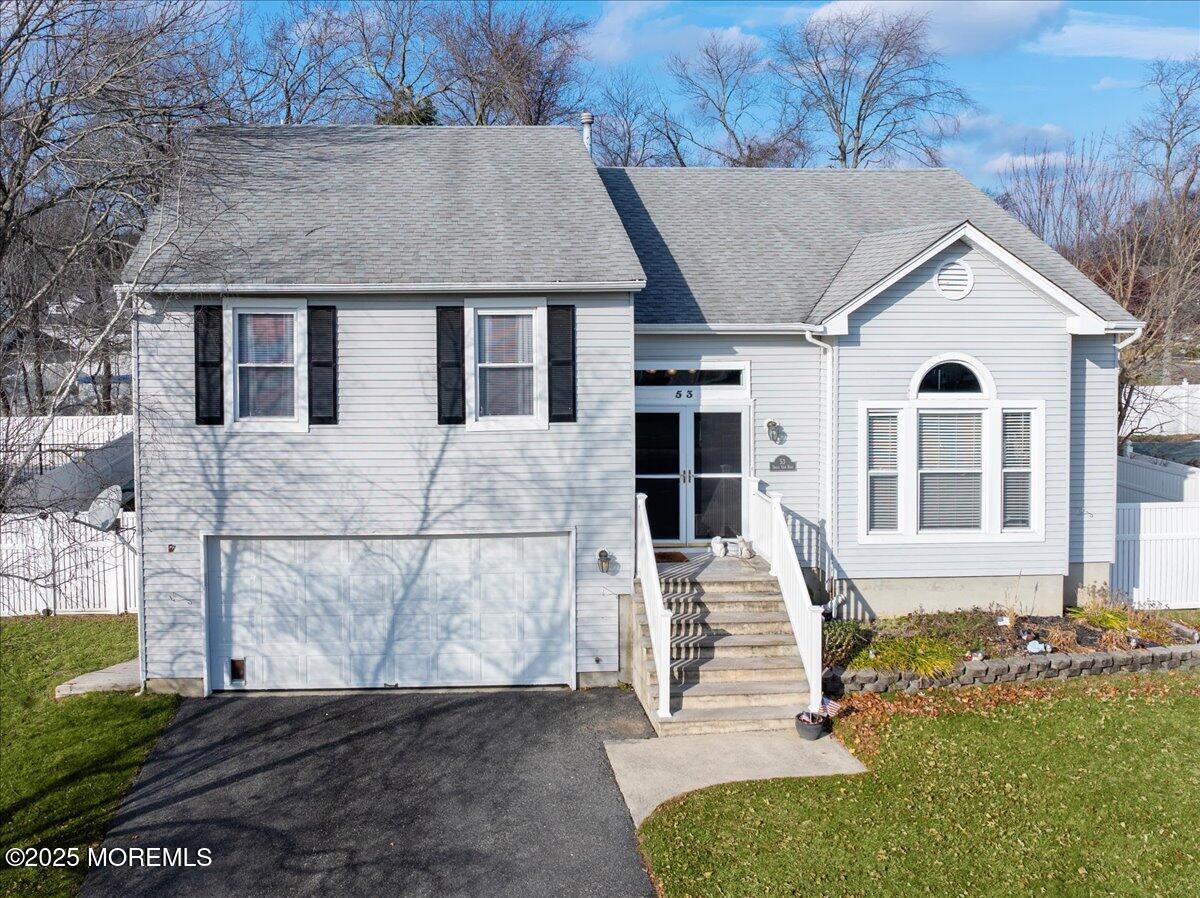 53 Sweet Gum Road Howell, NJ 07731 - Photo 2 of 62 a front view of a house with a yard