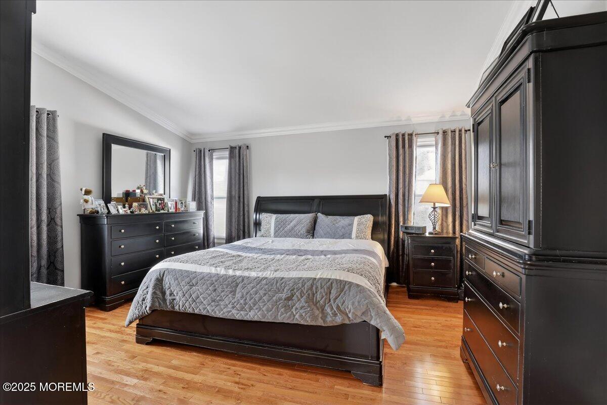 53 Sweet Gum Road Howell, NJ 07731 - Photo 25 of 62 a bedroom with a bed and dresser with mirror