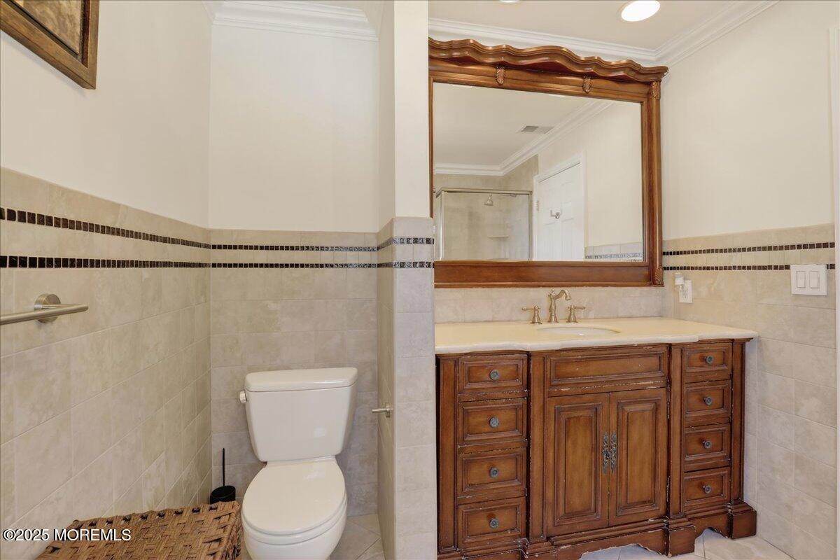 53 Sweet Gum Road Howell, NJ 07731 - Photo 29 of 62 a bathroom with a granite countertop toilet sink and mirror