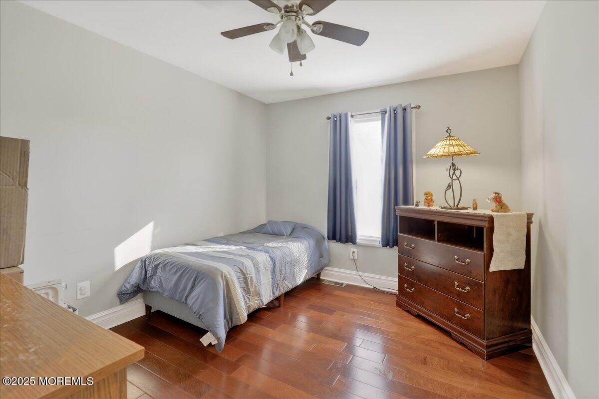 53 Sweet Gum Road Howell, NJ 07731 - Photo 30 of 62 a bedroom with a bed and a dresser