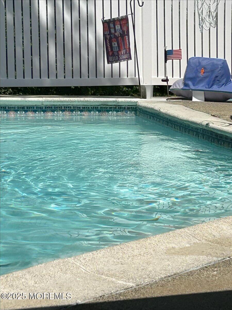 53 Sweet Gum Road Howell, NJ 07731 - Photo 44 of 62 a view of a swimming pool with an outdoor