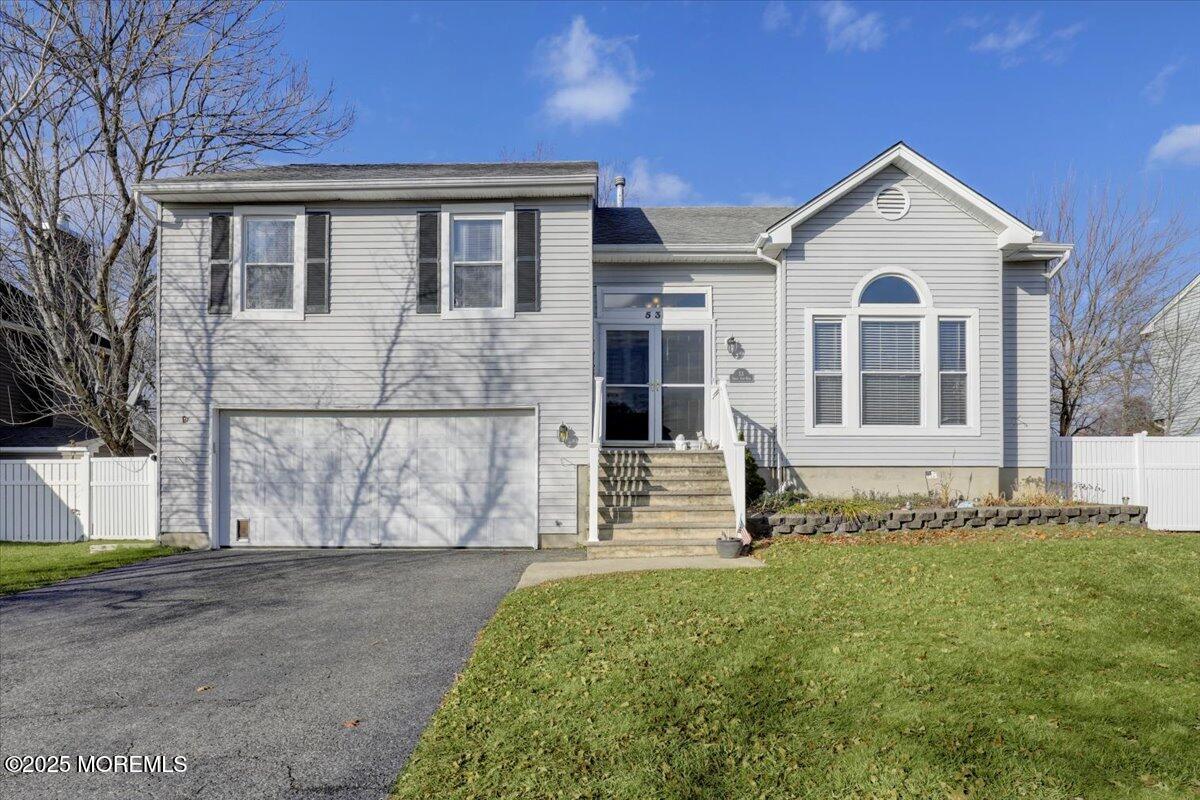 53 Sweet Gum Road Howell, NJ 07731 - Photo 59 of 62 a front view of a house with a garden