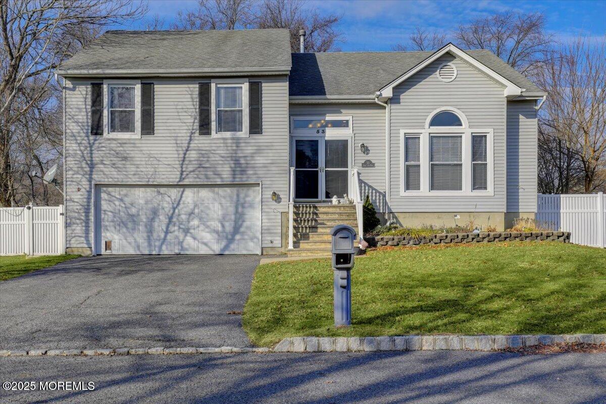 53 Sweet Gum Road Howell, NJ 07731 - Photo 60 of 62 a front view of a house with a yard