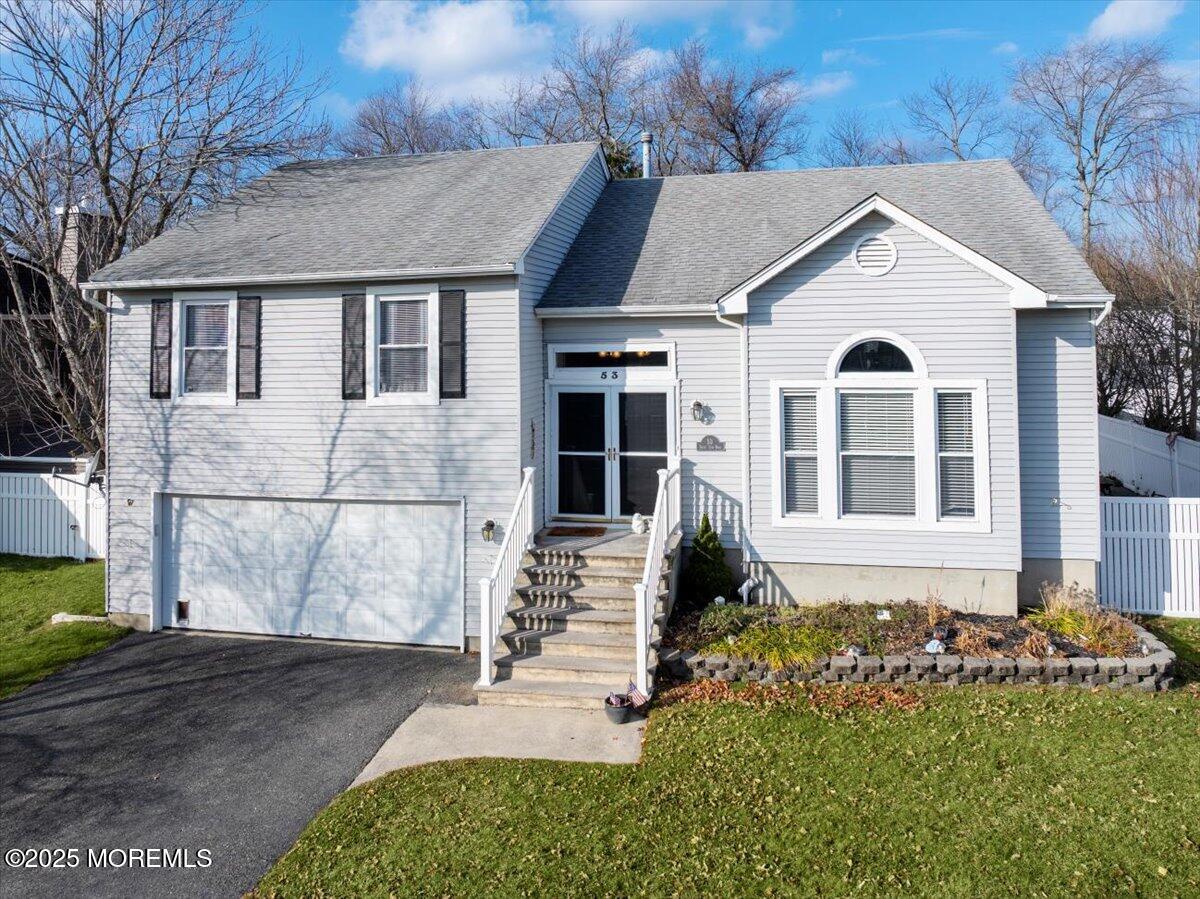 53 Sweet Gum Road Howell, NJ 07731 - Photo 61 of 62 a front view of a house with a garden