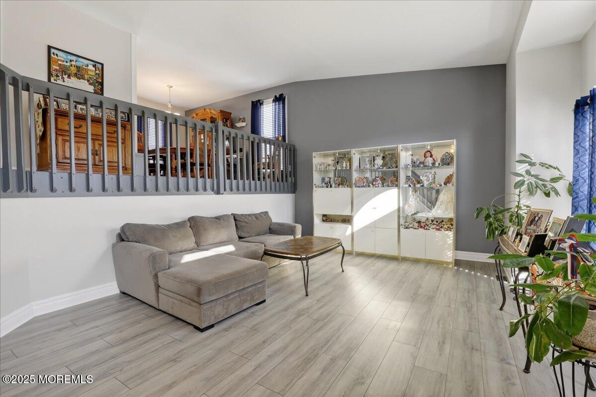 53 Sweet Gum Road Howell, NJ 07731 - Photo 7 of 62 a living room with furniture and a wooden floor