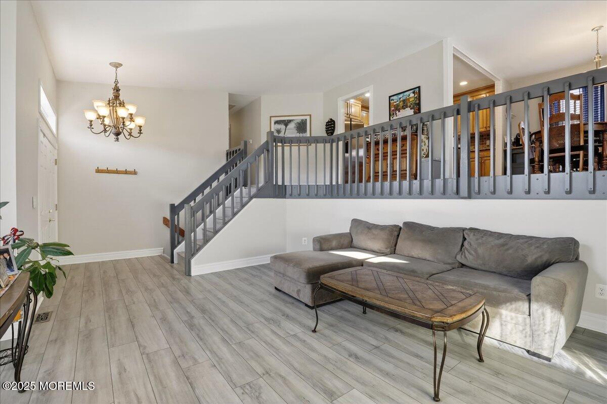 53 Sweet Gum Road Howell, NJ 07731 - Photo 8 of 62 a living room with furniture and a wooden floor