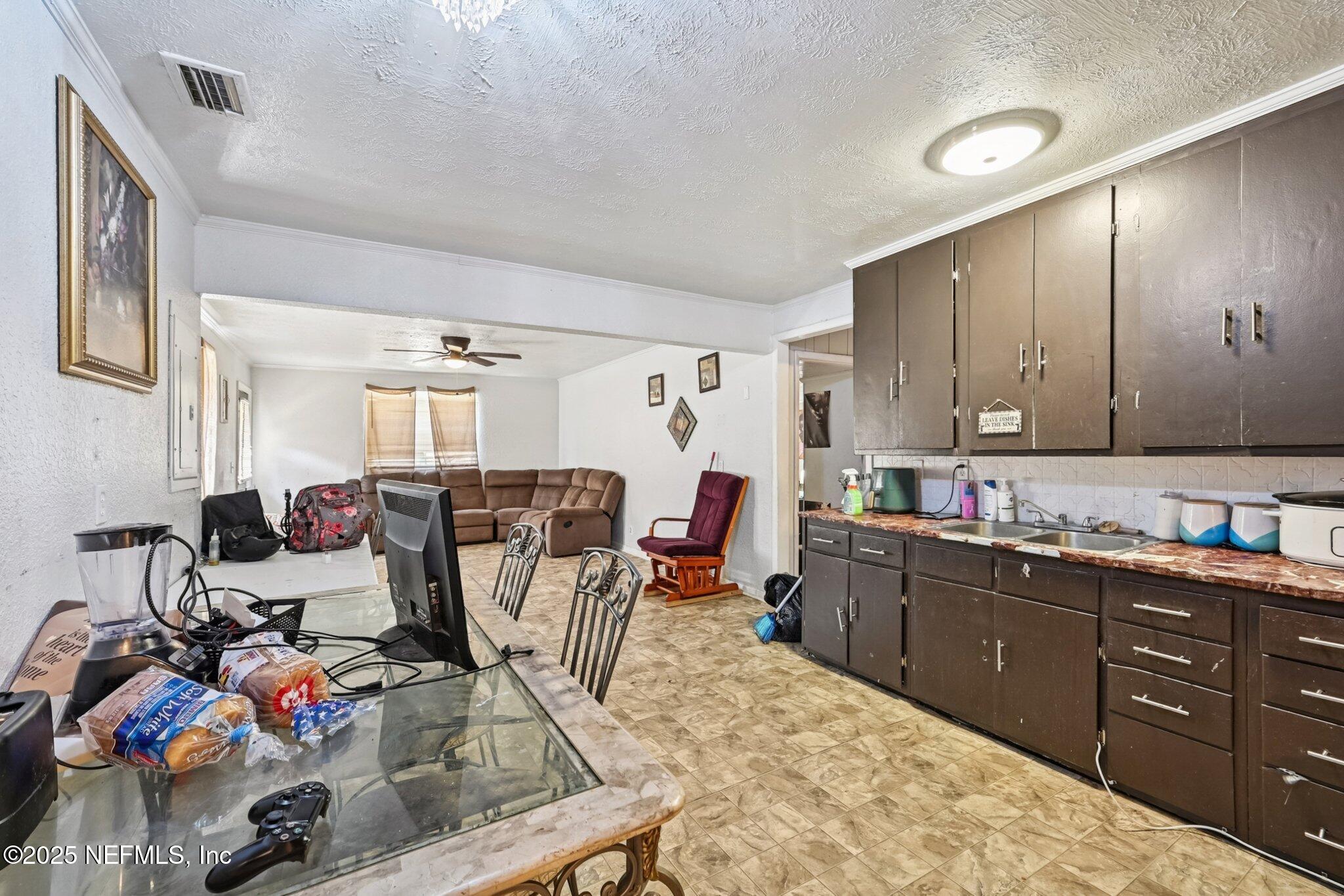 5635 Atlee Avenue Jacksonville, FL 32205 - Photo 11 of 31 a view of a kitchen and dining room