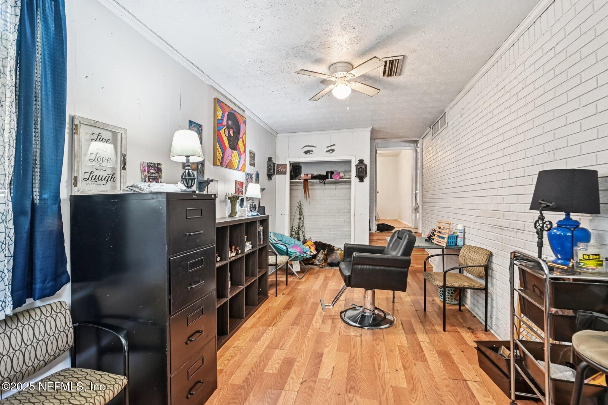 5635 Atlee Avenue Jacksonville, FL 32205 - Photo 12 of 31 a living room with furniture and wooden floor