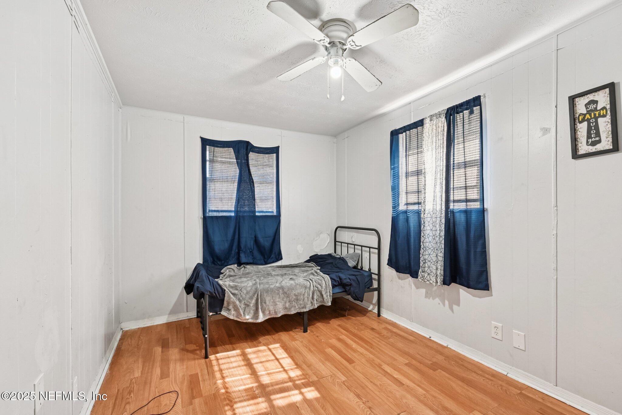 5635 Atlee Avenue Jacksonville, FL 32205 - Photo 17 of 31 a bedroom with a bed and a window