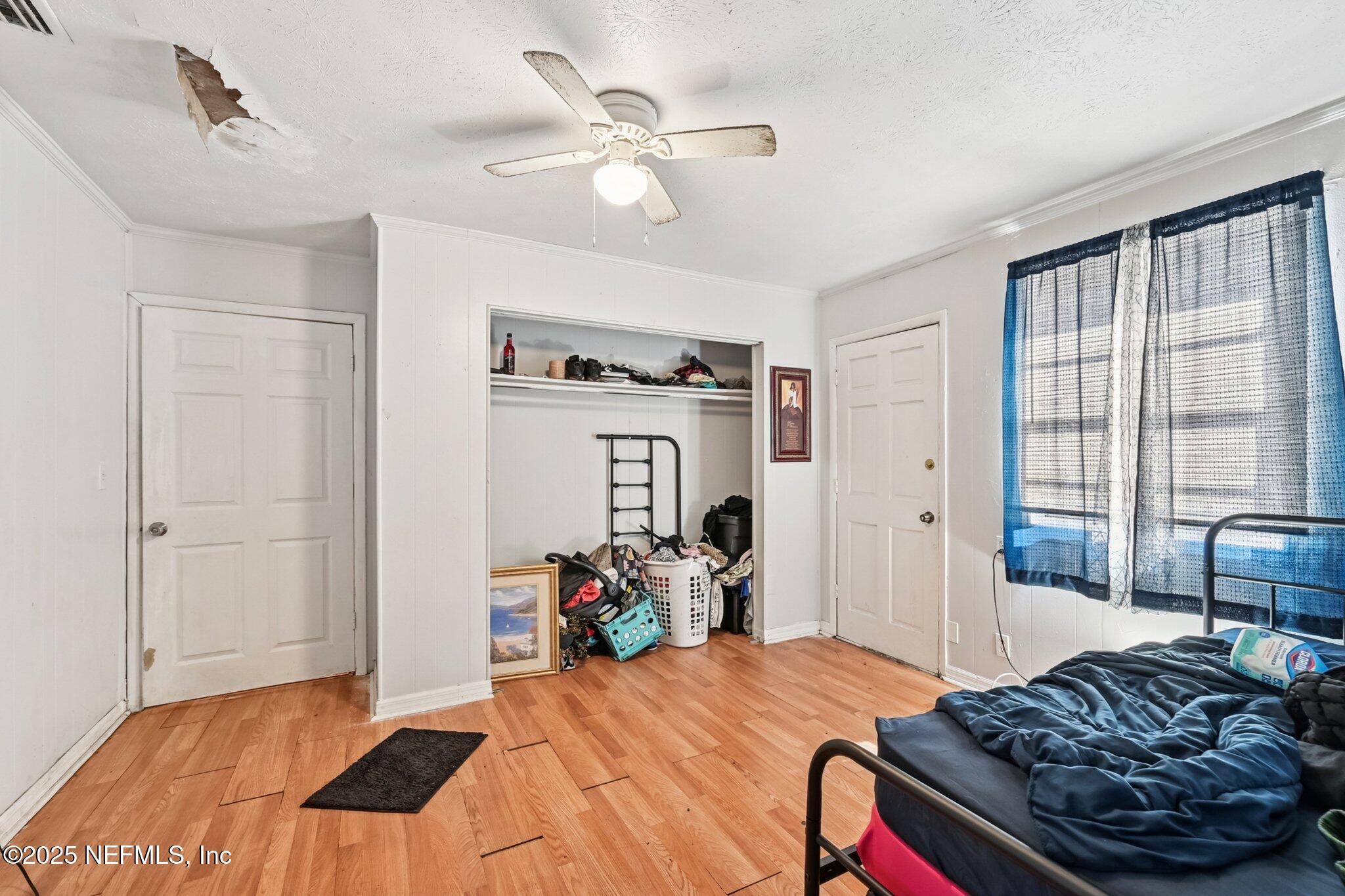 5635 Atlee Avenue Jacksonville, FL 32205 - Photo 21 of 31 a bedroom with bed and a window