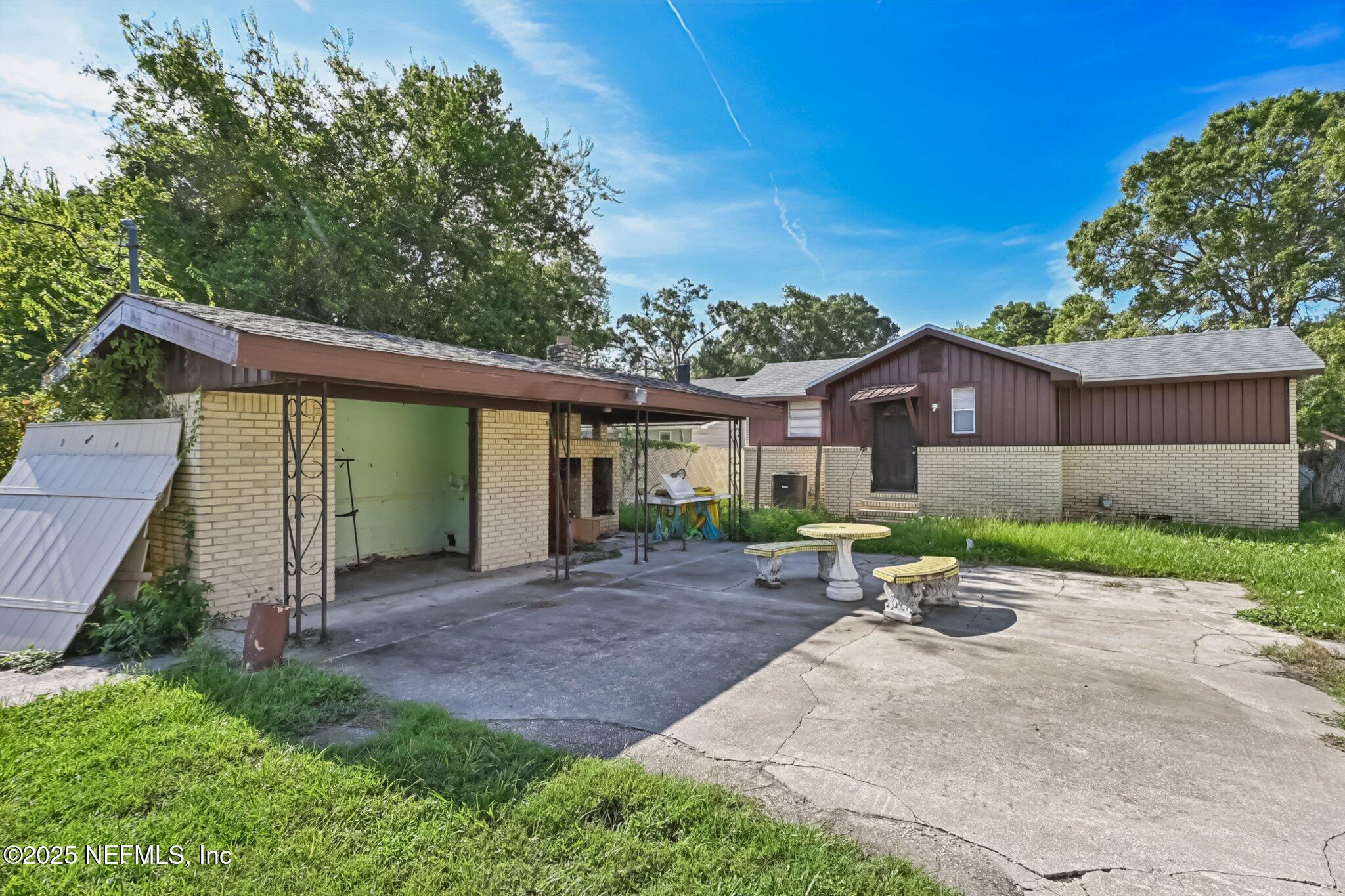 5635 Atlee Avenue Jacksonville, FL 32205 - Photo 26 of 31 a view of a house with backyard and a garden