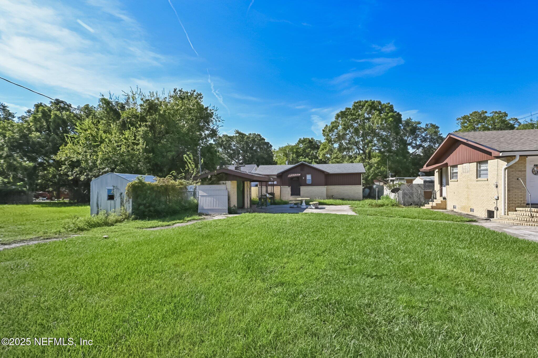 5635 Atlee Avenue Jacksonville, FL 32205 - Photo 27 of 31 a front view of a house with garden