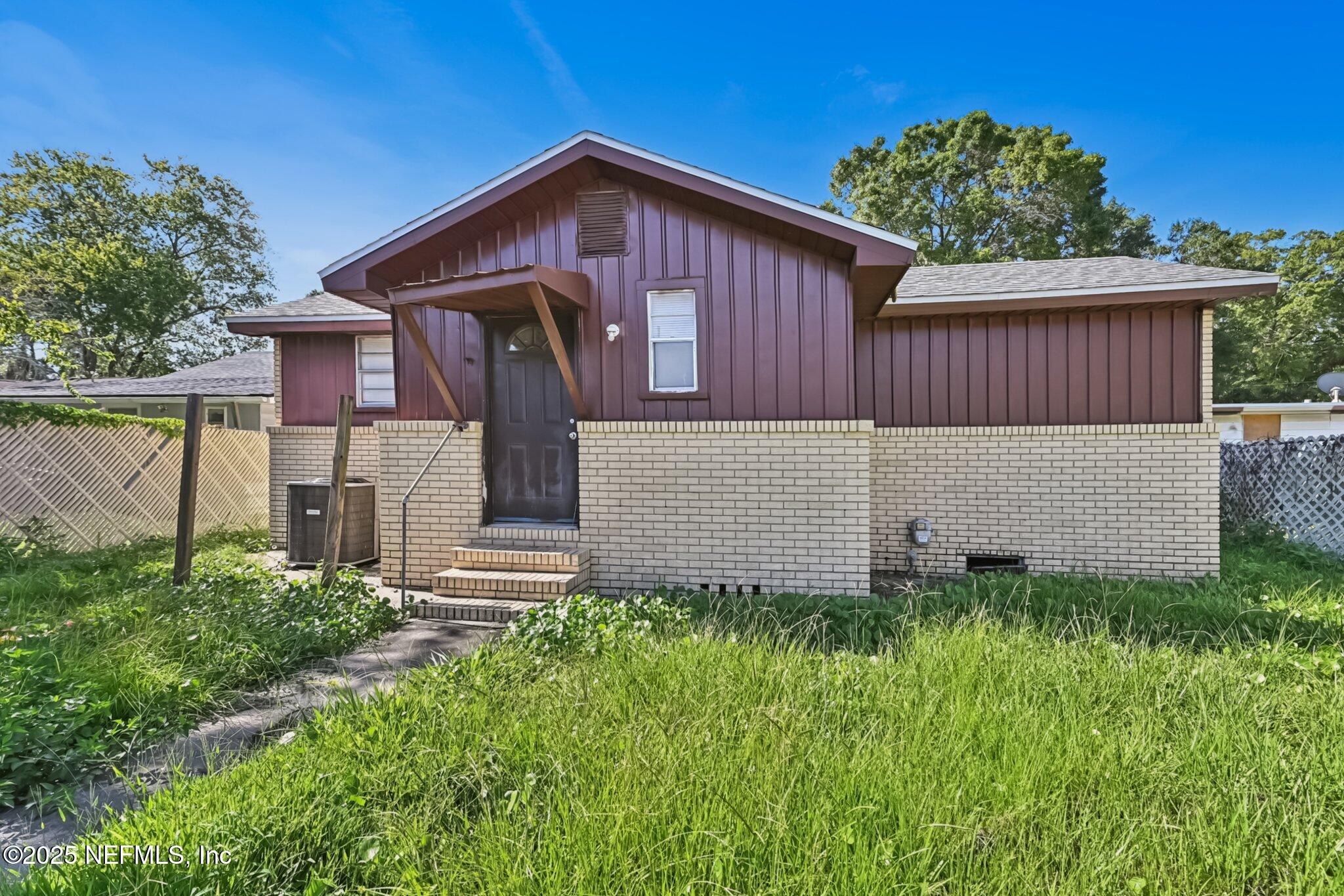 5635 Atlee Avenue Jacksonville, FL 32205 - Photo 31 of 31 a front view of a house with a fence