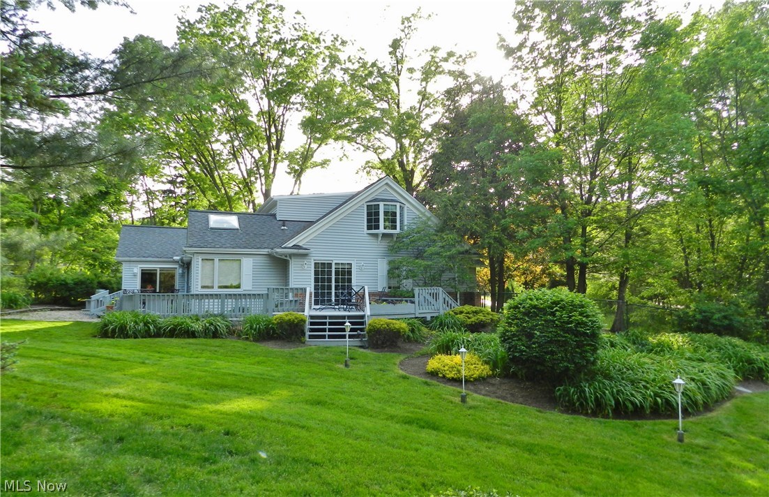 30065 Bolingbrook Road Pepper Pike, OH 44124 - Photo 28 of 33 Time to get out the grill and enjoy the weather right in your own back yard. Acccess the deck from the Great room (far left) and the Master bedroom sliders (center.)