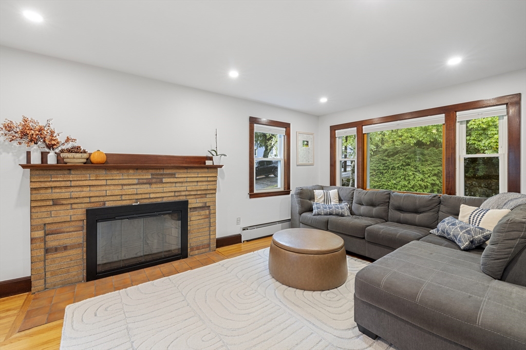 10 Selkirk Road Arlington, MA 02476 - Photo 3 of 25 a living room with furniture and a fireplace