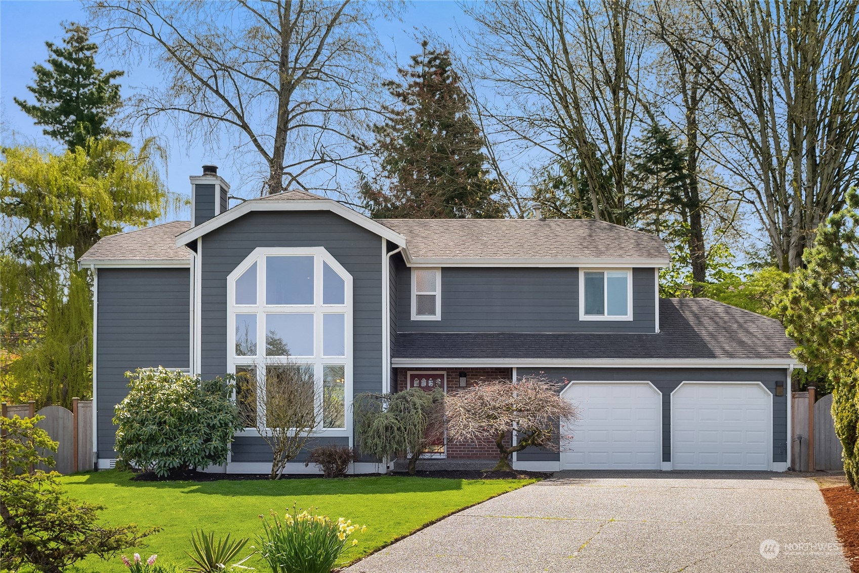 23530 22nd Avenue Southeast Bothell, WA 98021 - Photo 1 of 30 a front view of a house with a garden
