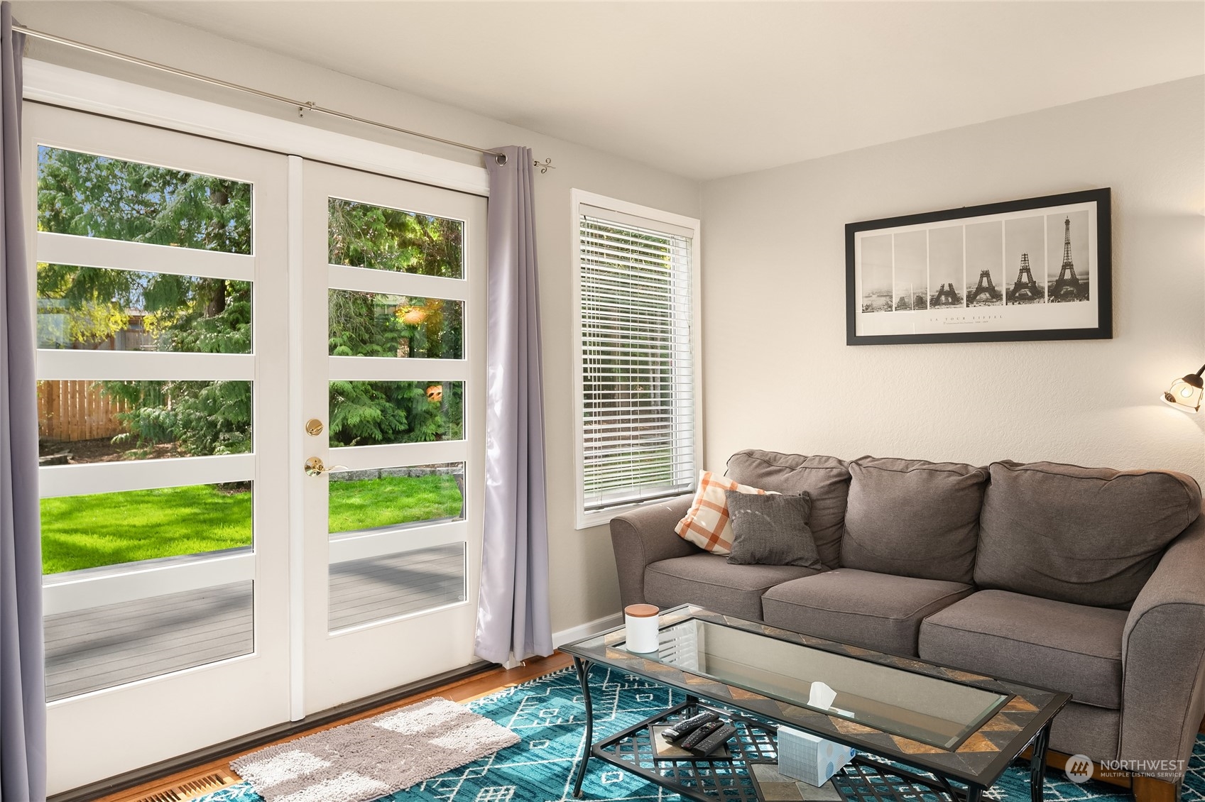 23530 22nd Avenue Southeast Bothell, WA 98021 - Photo 14 of 30 a blue couch sitting in front of a window