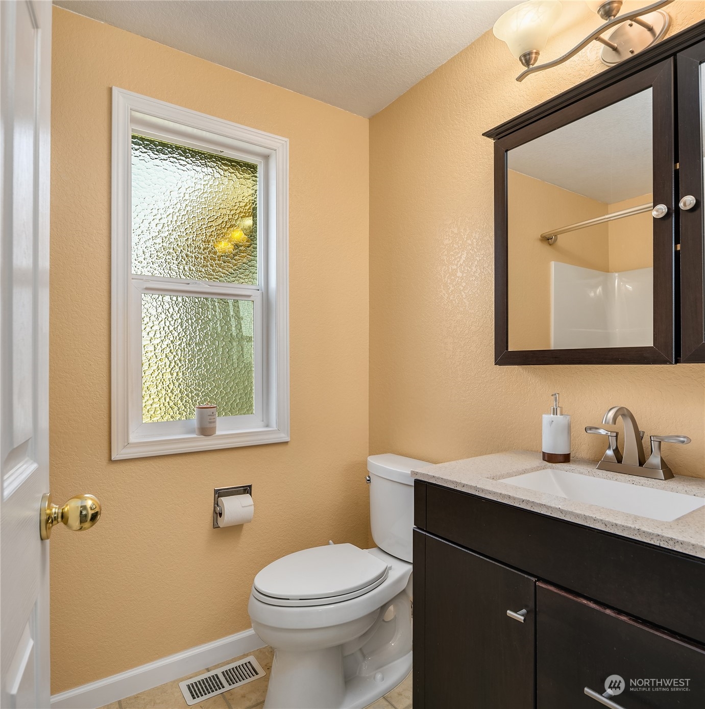 23530 22nd Avenue Southeast Bothell, WA 98021 - Photo 20 of 30 a bathroom with a toilet sink vanity and mirror
