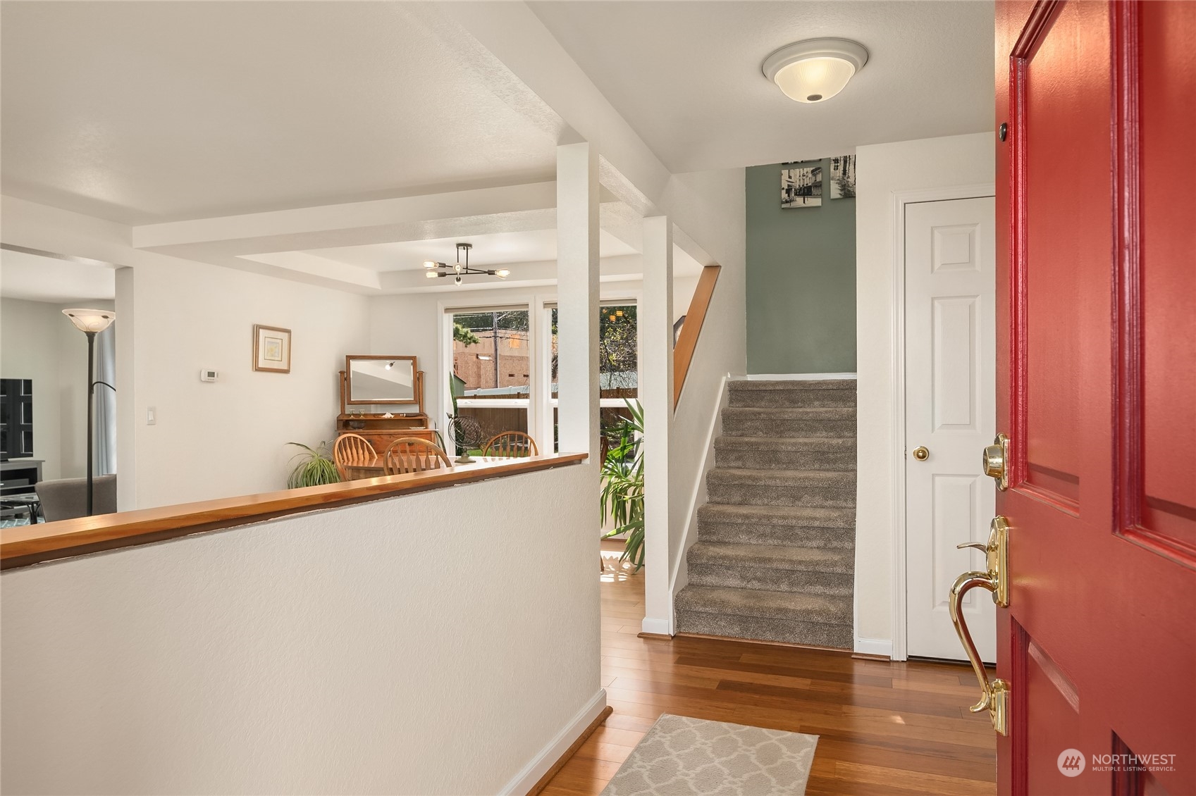 23530 22nd Avenue Southeast Bothell, WA 98021 - Photo 2 of 30 a view of a hallway with wooden floor and staircase