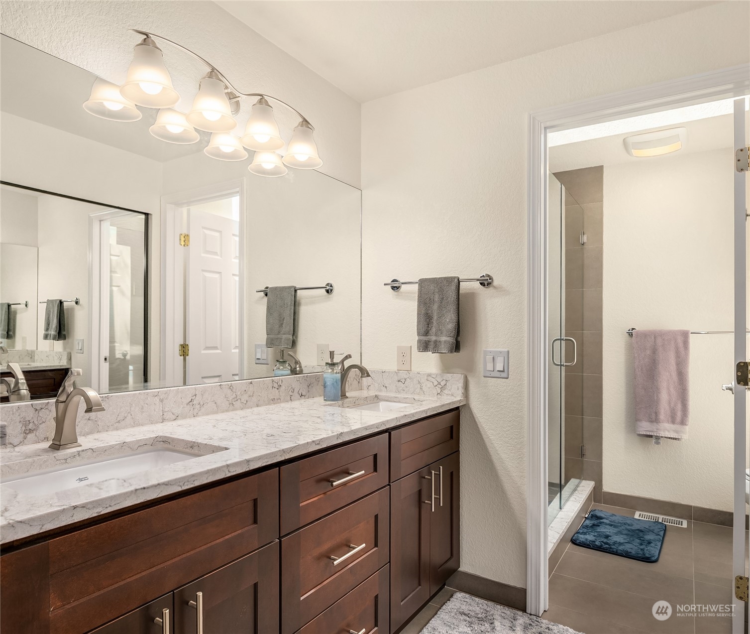 23530 22nd Avenue Southeast Bothell, WA 98021 - Photo 24 of 30 a bathroom with a granite countertop sink and a mirror