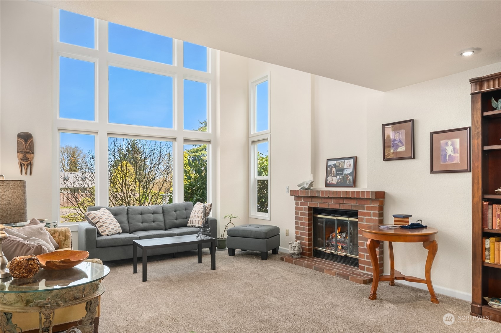 23530 22nd Avenue Southeast Bothell, WA 98021 - Photo 4 of 30 a living room with furniture a fireplace and a large window