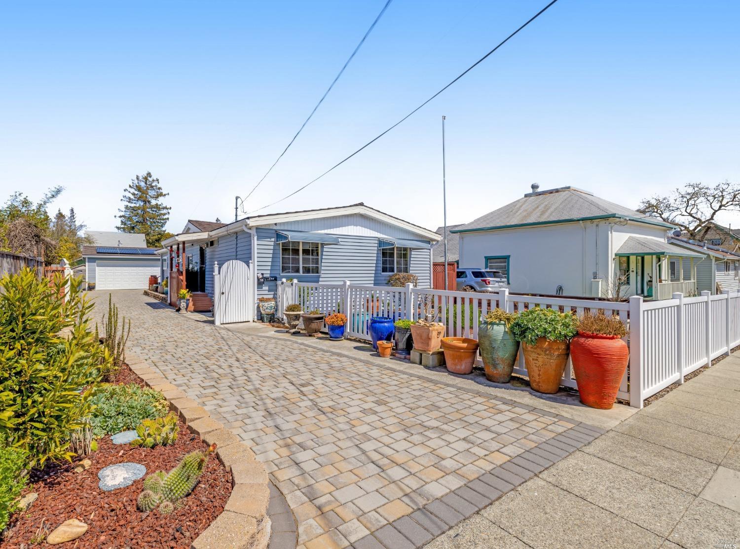Bonus, your outside oasis offers plenty of room for gardening and entertaining with an oversized two car garage, workshop, office, and plenty of off-street parking. Both home and guest quarter are cozy with all the comforts of home starting with the welcoming front and back porches. The beautiful paver driveway with gated privacy offers excellent location in West Petaluma only moments from downtown and close to schools.  This home is a very special opportunity for its next guardian. Welcome to 18 Webster Street!