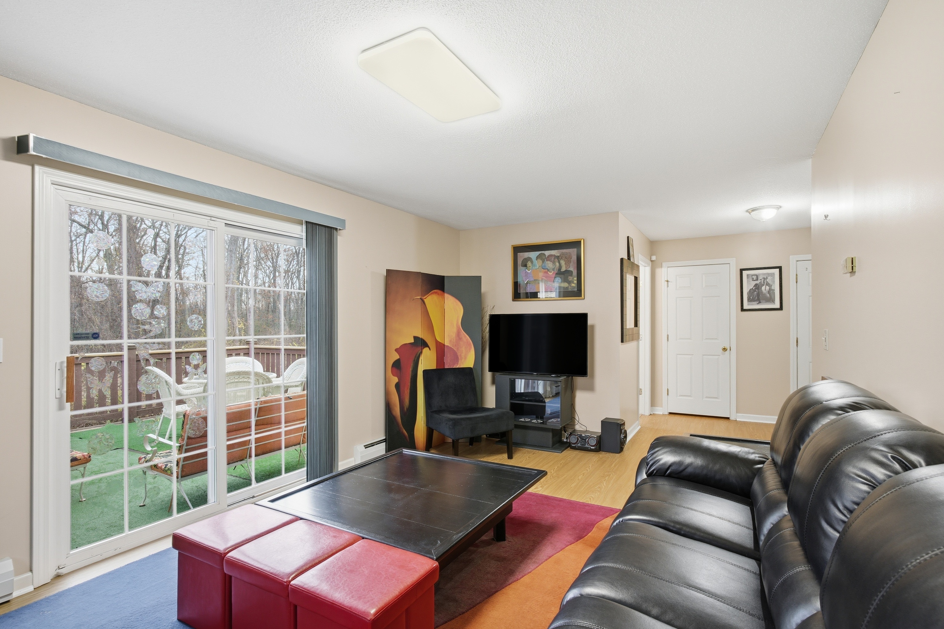 35 Fairfield Lane Bloomfield, CT 06002 - Photo 12 of 40 a living room with furniture a flat screen tv and a window