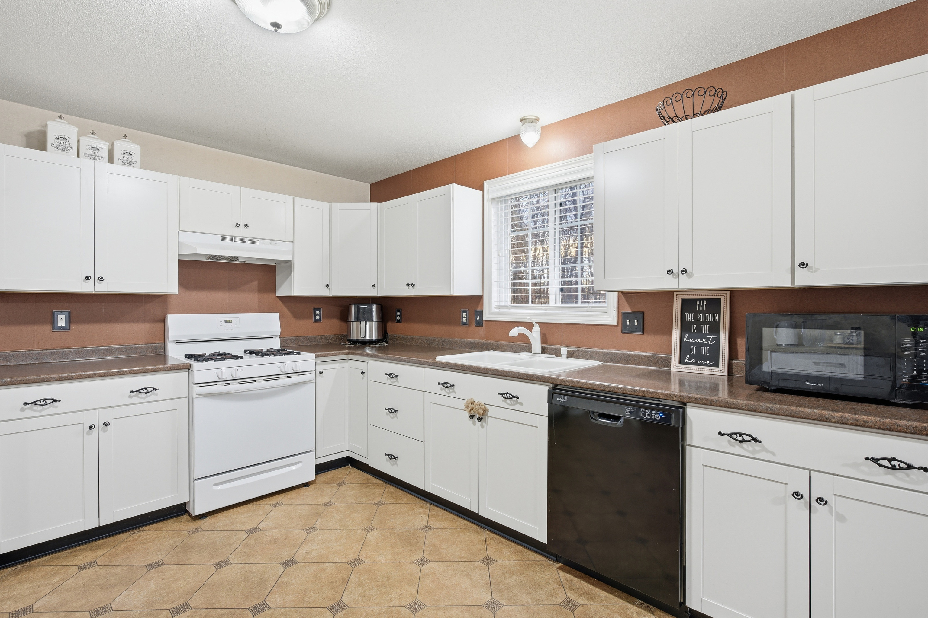35 Fairfield Lane Bloomfield, CT 06002 - Photo 23 of 40 a kitchen with granite countertop white cabinets and white appliances