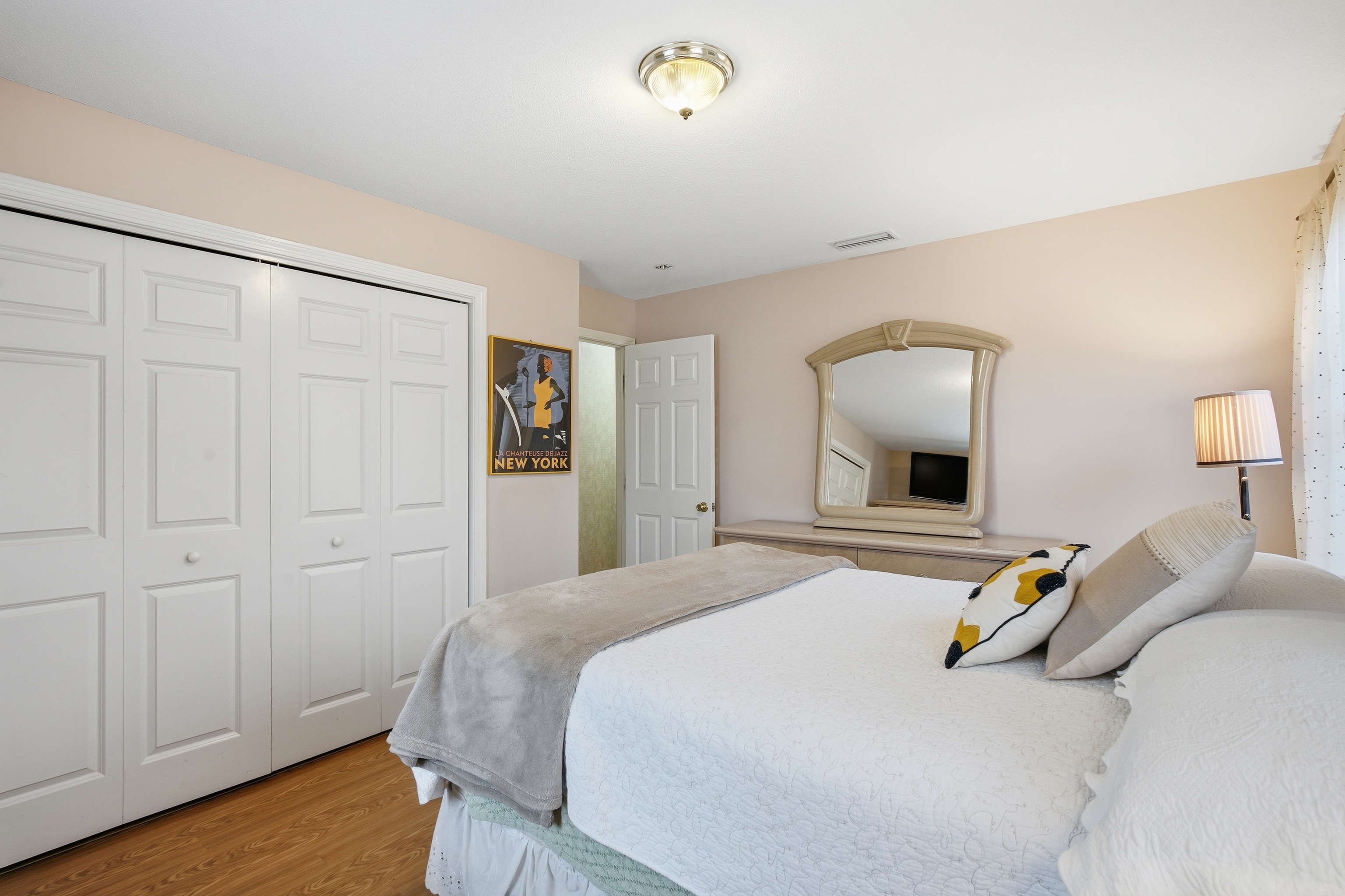 35 Fairfield Lane Bloomfield, CT 06002 - Photo 30 of 40 a bedroom with a bed and wooden floor