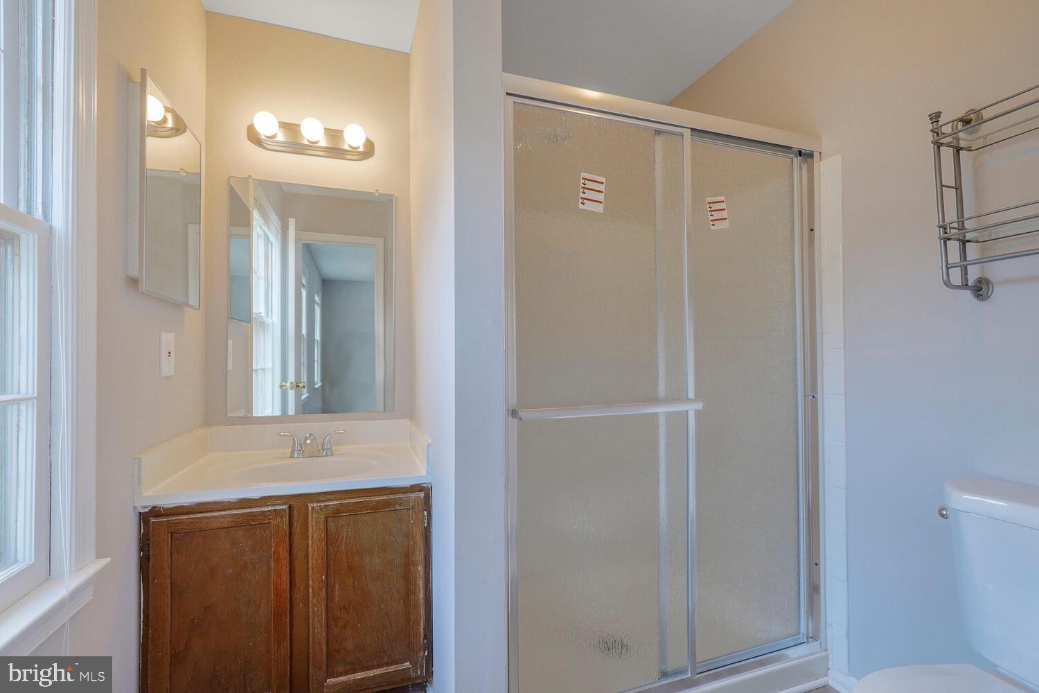 7314 Eggar Woods Lane Springfield, VA 22153 - Photo 12 of 23 a bathroom with a sink a toilet and shower