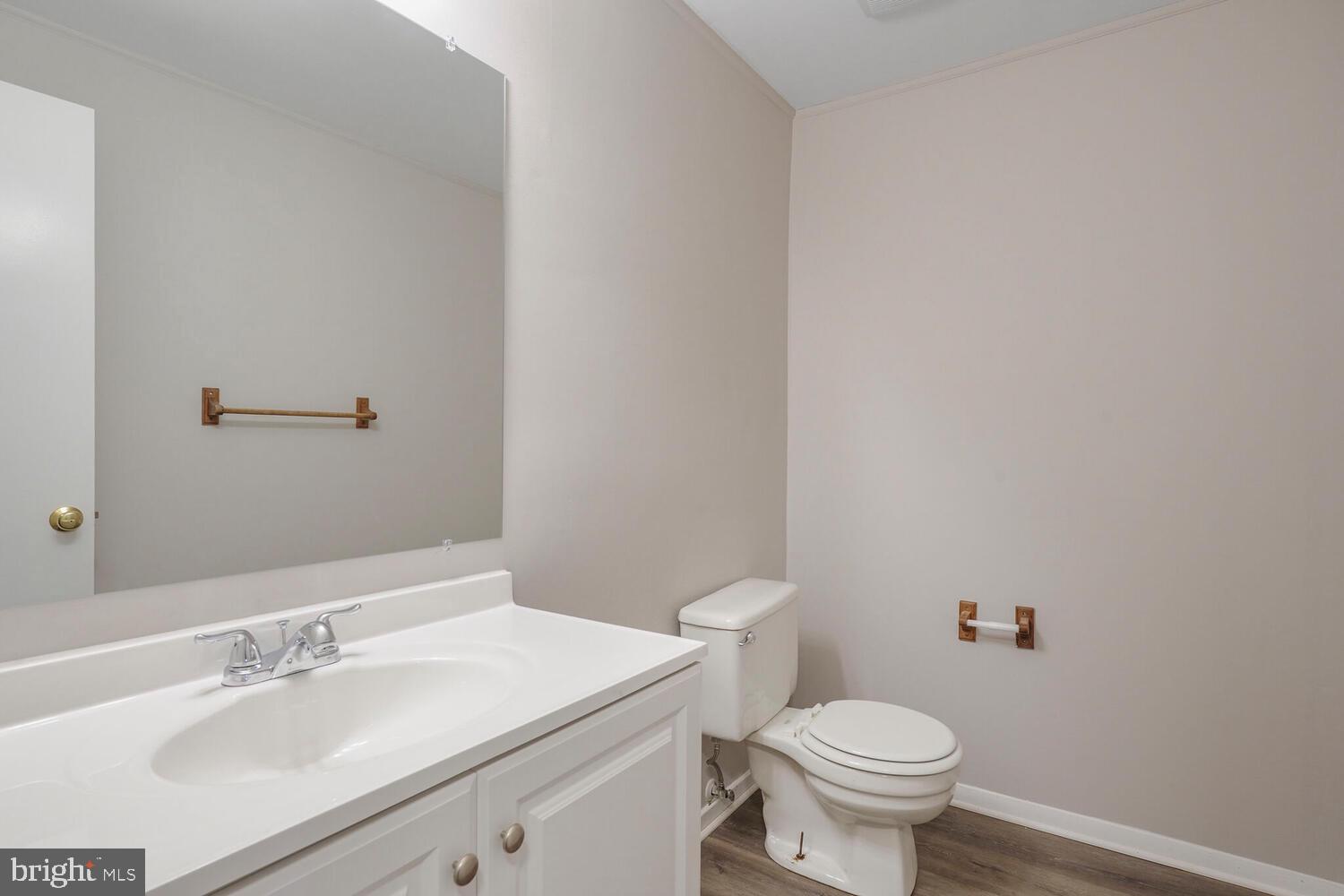 7314 Eggar Woods Lane Springfield, VA 22153 - Photo 18 of 23 a bathroom with a sink toilet and a mirror