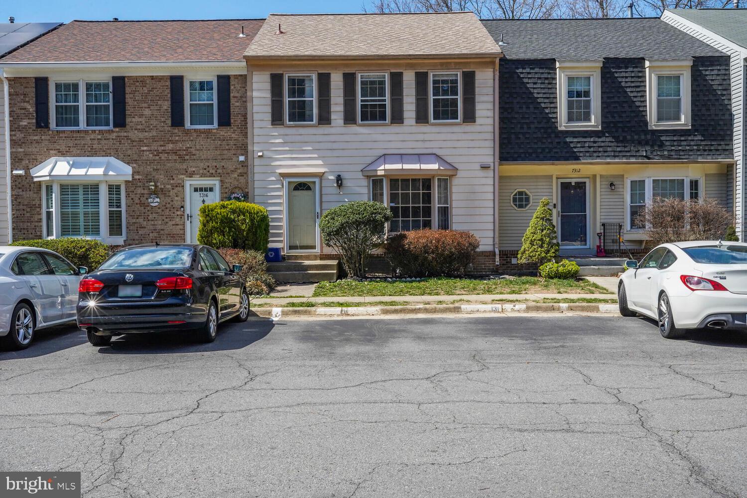 7314 Eggar Woods Lane Springfield, VA 22153 - Photo 2 of 23 a car parked in front of a building