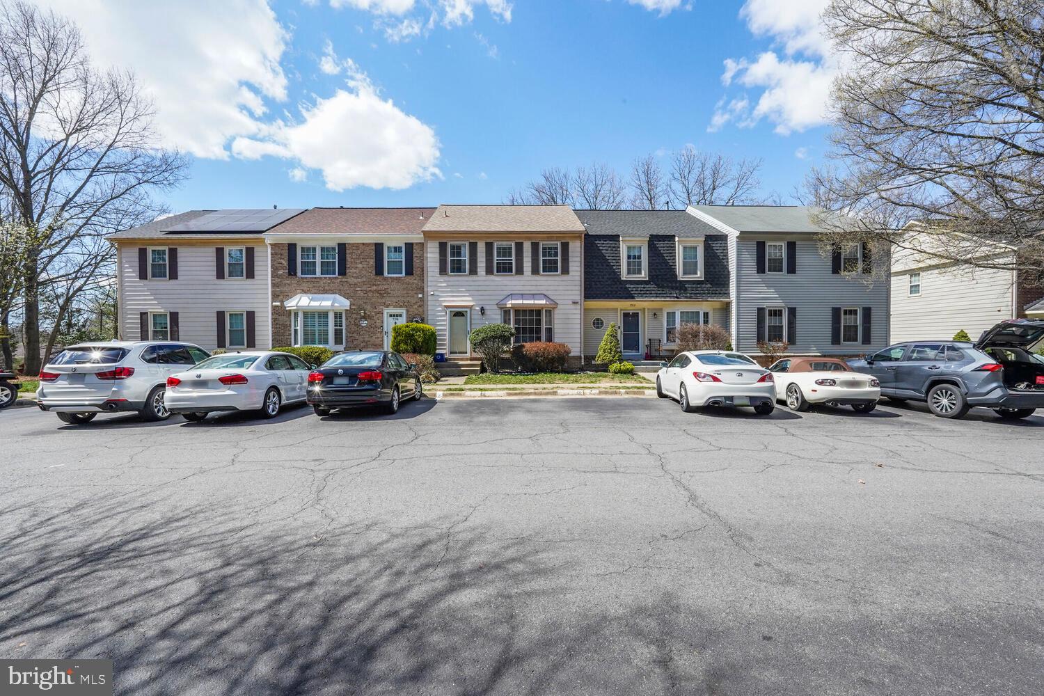 7314 Eggar Woods Lane Springfield, VA 22153 - Photo 3 of 23 a buildings with car parked in front of it