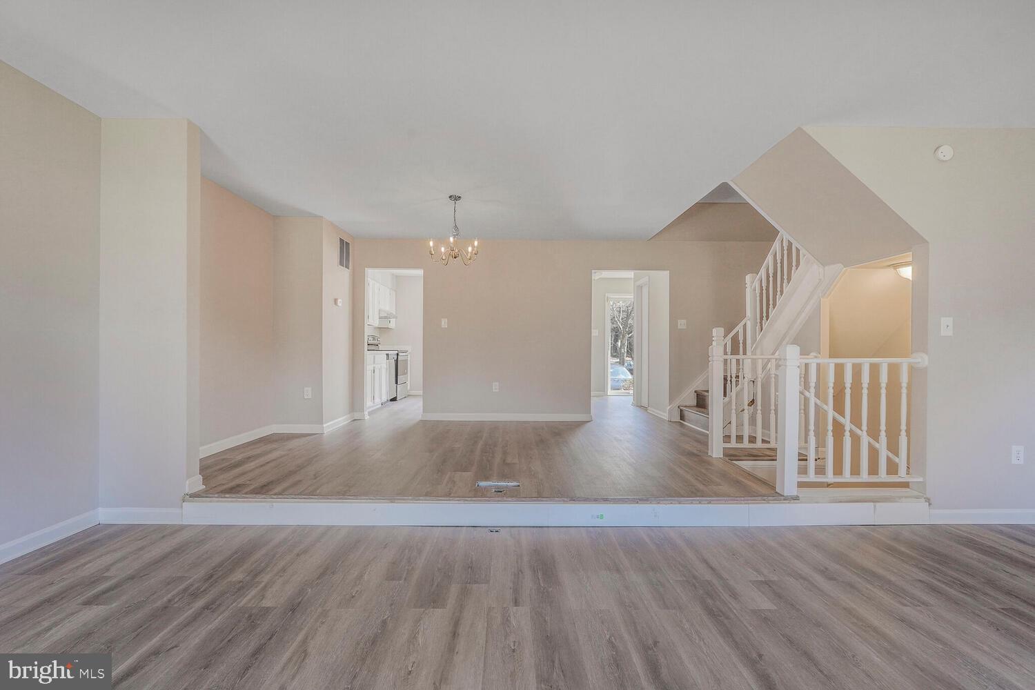 7314 Eggar Woods Lane Springfield, VA 22153 - Photo 9 of 23 a view of empty room with wooden floor