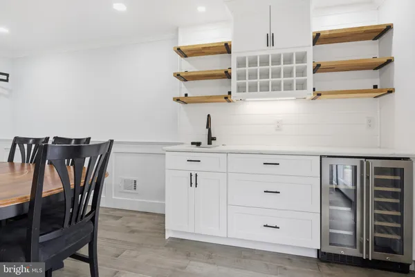 a kitchen with cabinets and window
